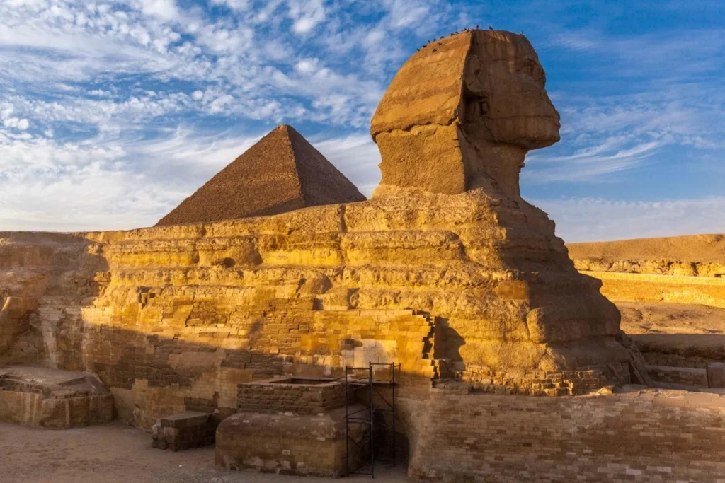 Sphinx and pyramids at Giza under clear blue sky