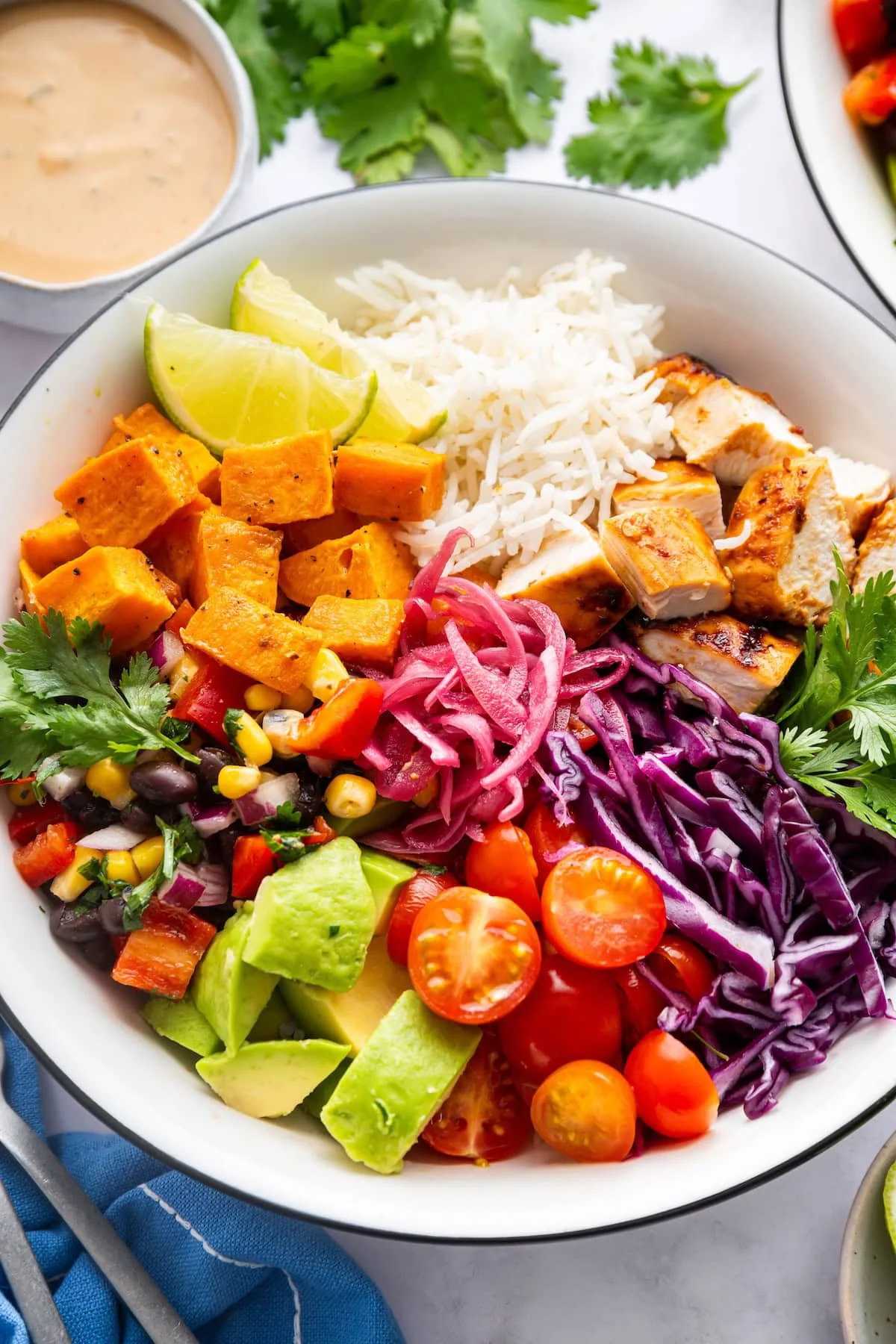 BBQ chicken bowl with sweet potatoes black beans and ranch dressing