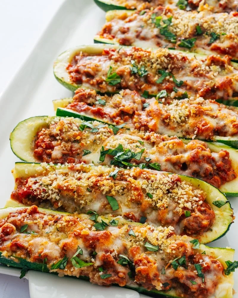 Golden baked stuffed zucchini boats topped with melted cheese