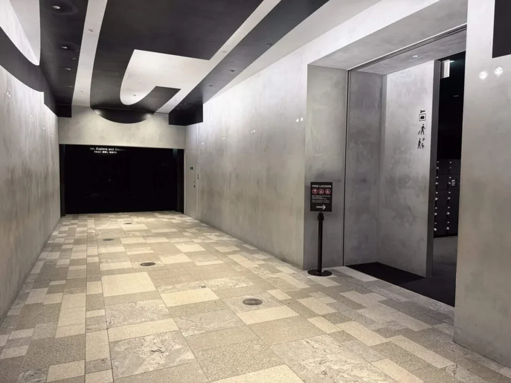 Visitor walking through teamLab Borderless corridor in Tokyo
