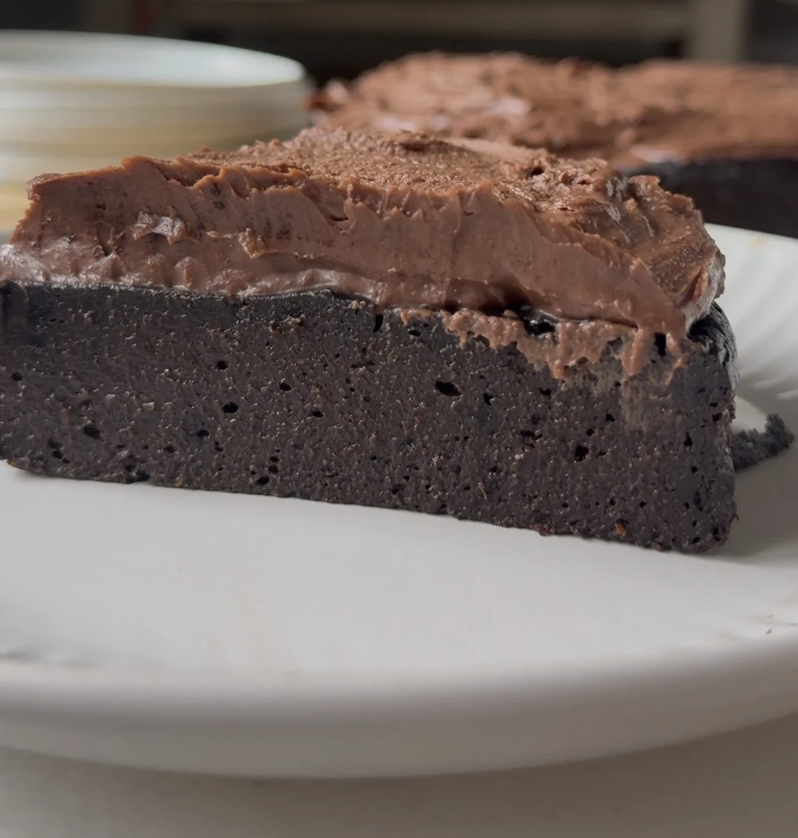 Rich fudgy healthy chocolate cake with dark ganache frosting