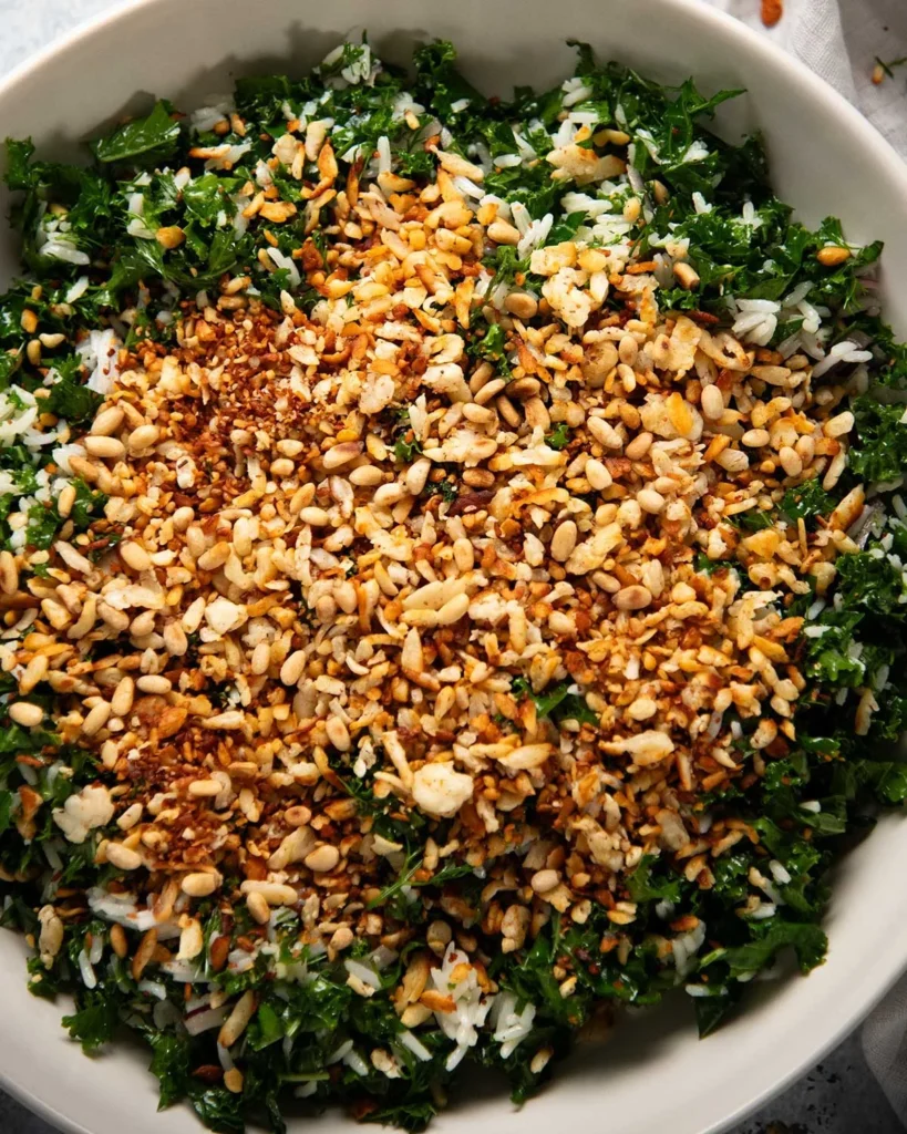 Golden crispy shredded halloumi crumbled over kale salad