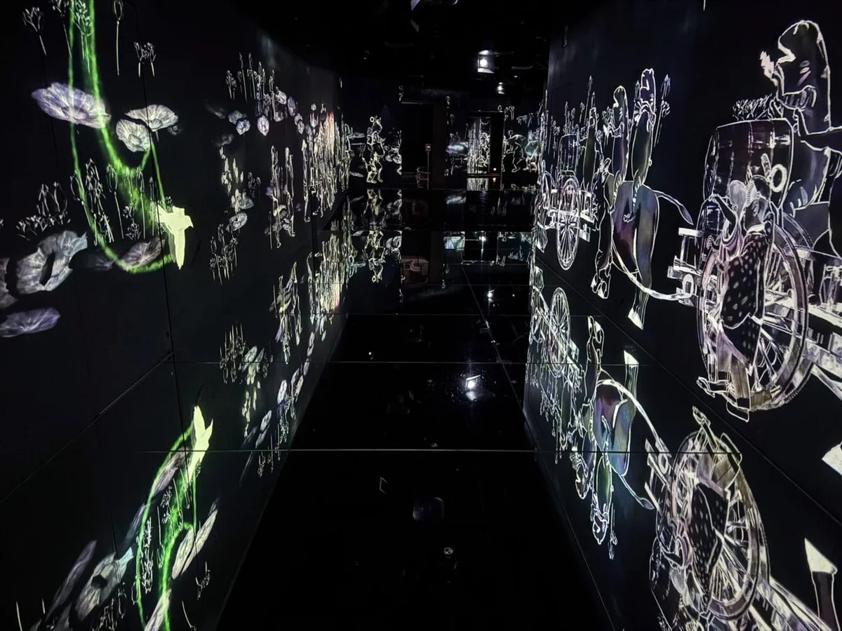 Flowers and People room with blooming projections on wall