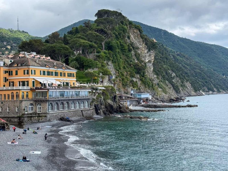 Yellow villa and terrace of the hotel overlooking Camogli beach