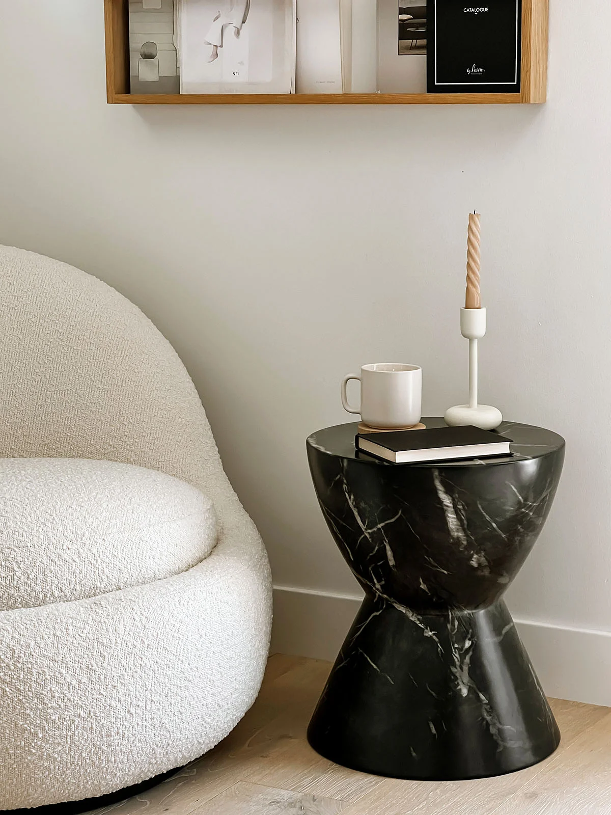 Black marble end table with decorative objects