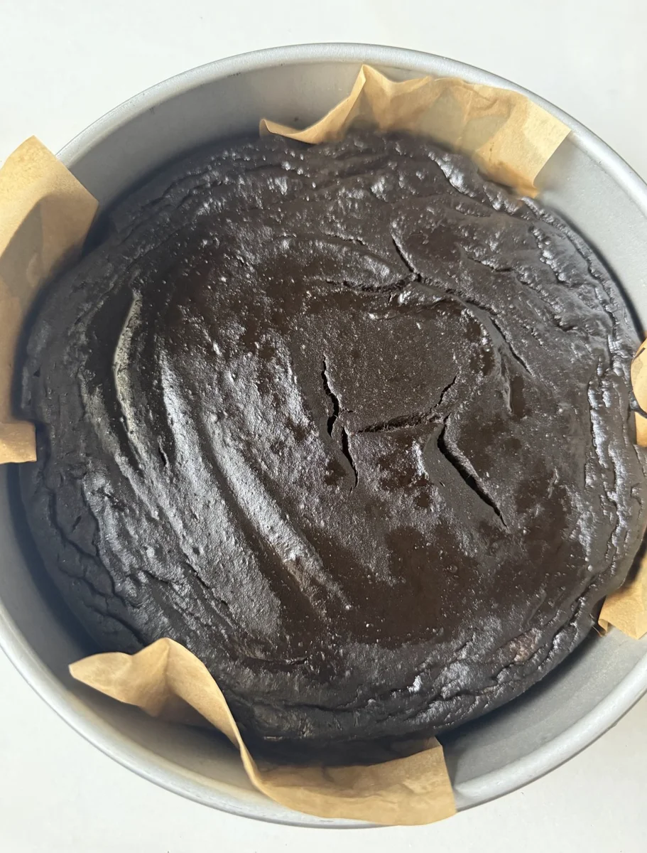 Baked chocolate cake cooling on wire rack after oven