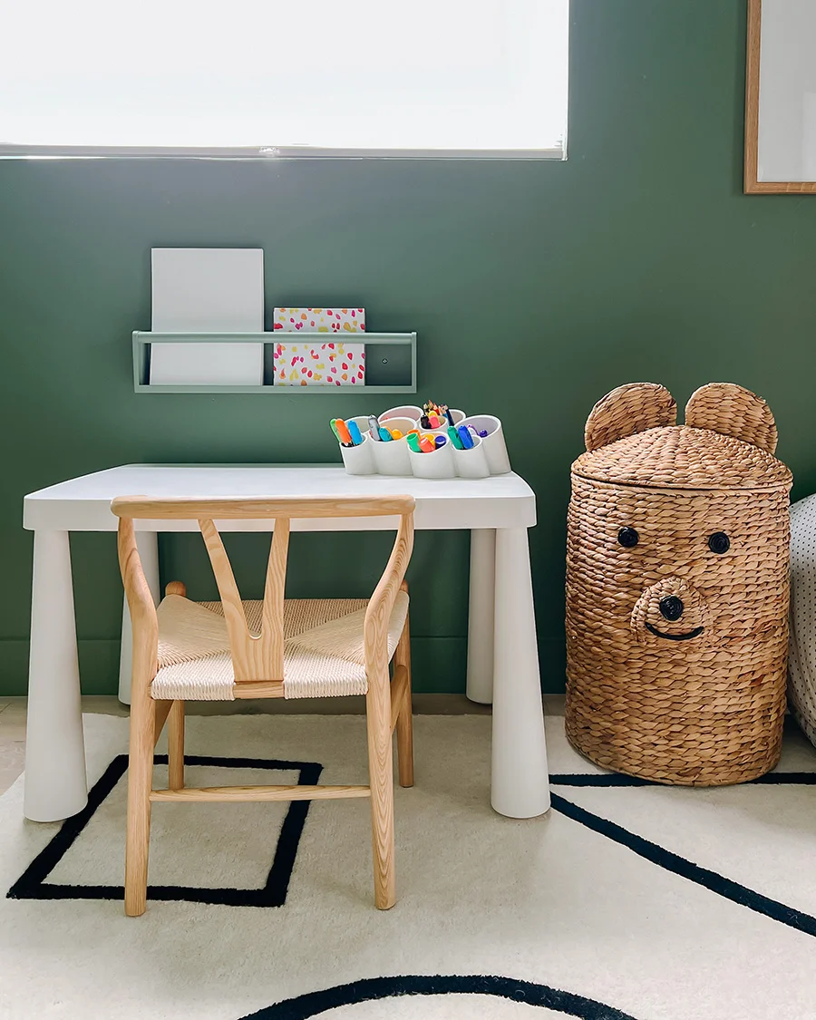 Green canopy over toddler reading nook with books