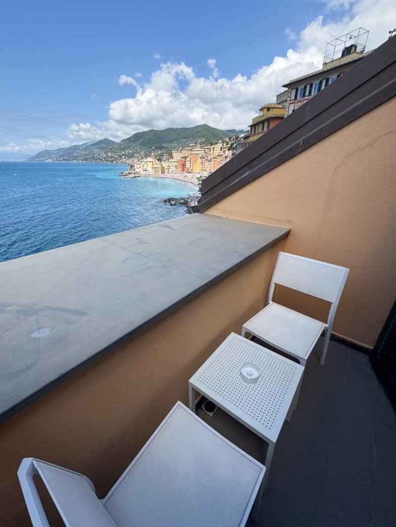 Balcony with Camogli coastline view at golden hour