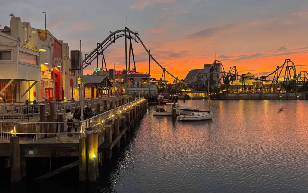 USJ waterfront at sunset with coaster silhouette over the water