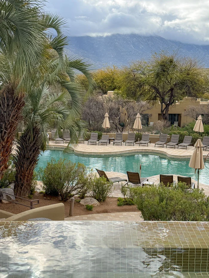 Miraval Arizona pool and desert mountains at dusk