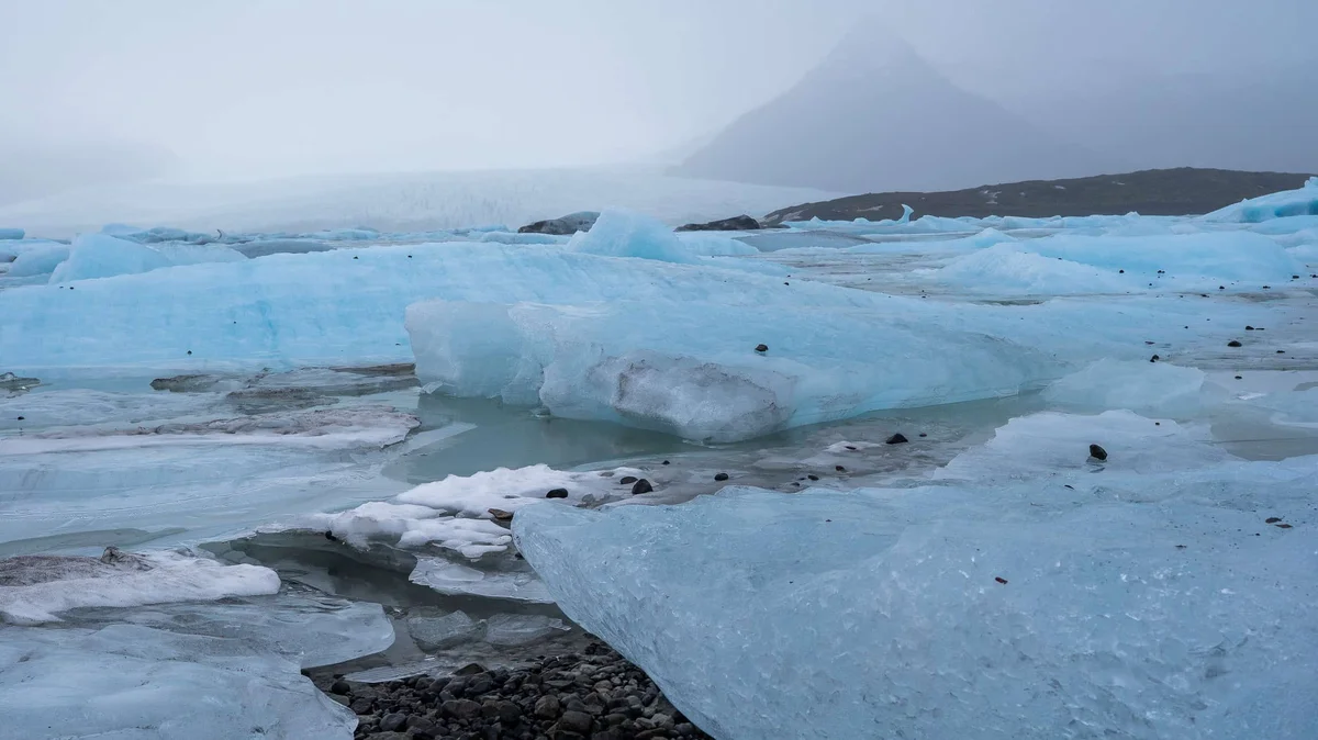 Iceland glacier lagoon with icebergs in golden winter light