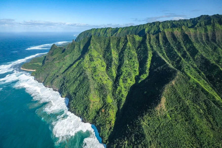 Na Pali coast cliffs seen from a doors-off helicopter