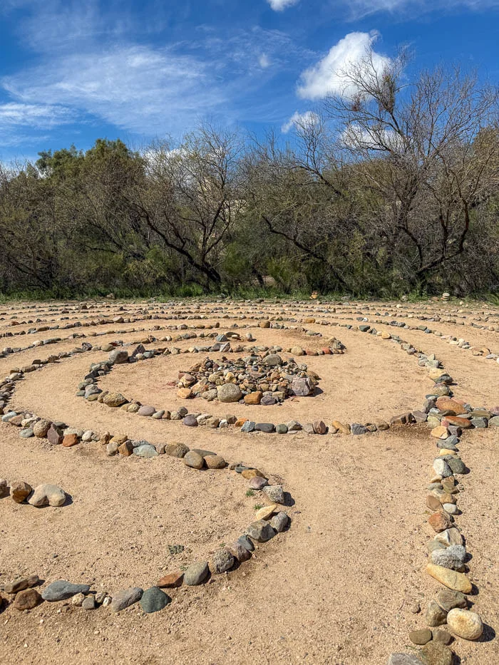 Stone labyrinth set in open desert ground