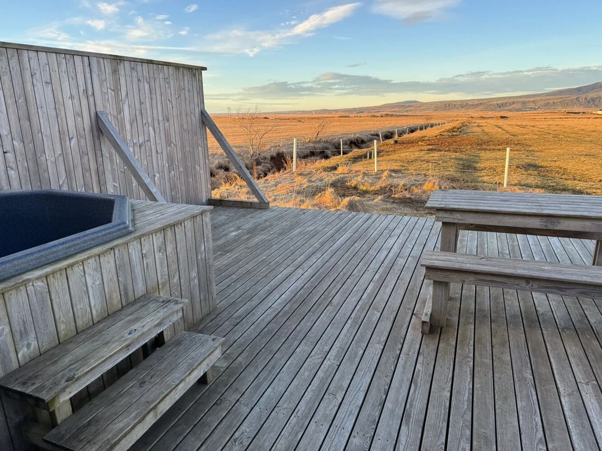 One-room wooden cabin with horse-themed decor in Iceland