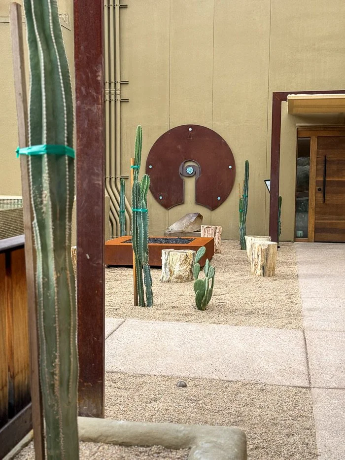 Desert courtyard with cacti and sculptural art