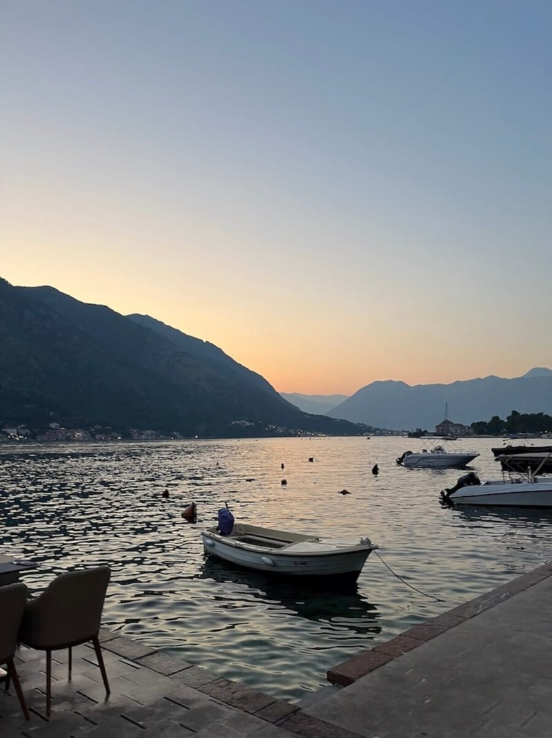 Sunset over the bay with boats at Perast